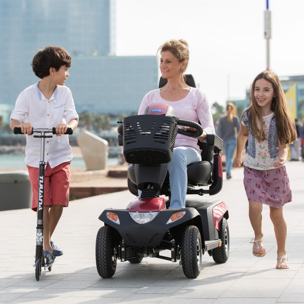 Invacare Orion Pro - Scooter in action on promenade.