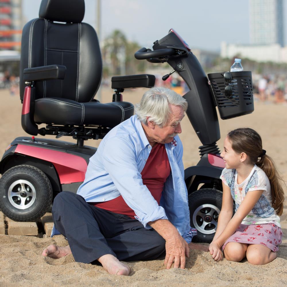 Invacare Orion Pro - Grandad on beach with young girl.
