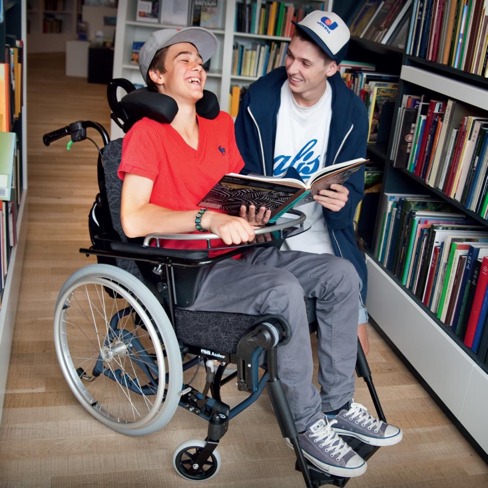 Invacare Rea Azalea Minor - Wheelchair in a Library.