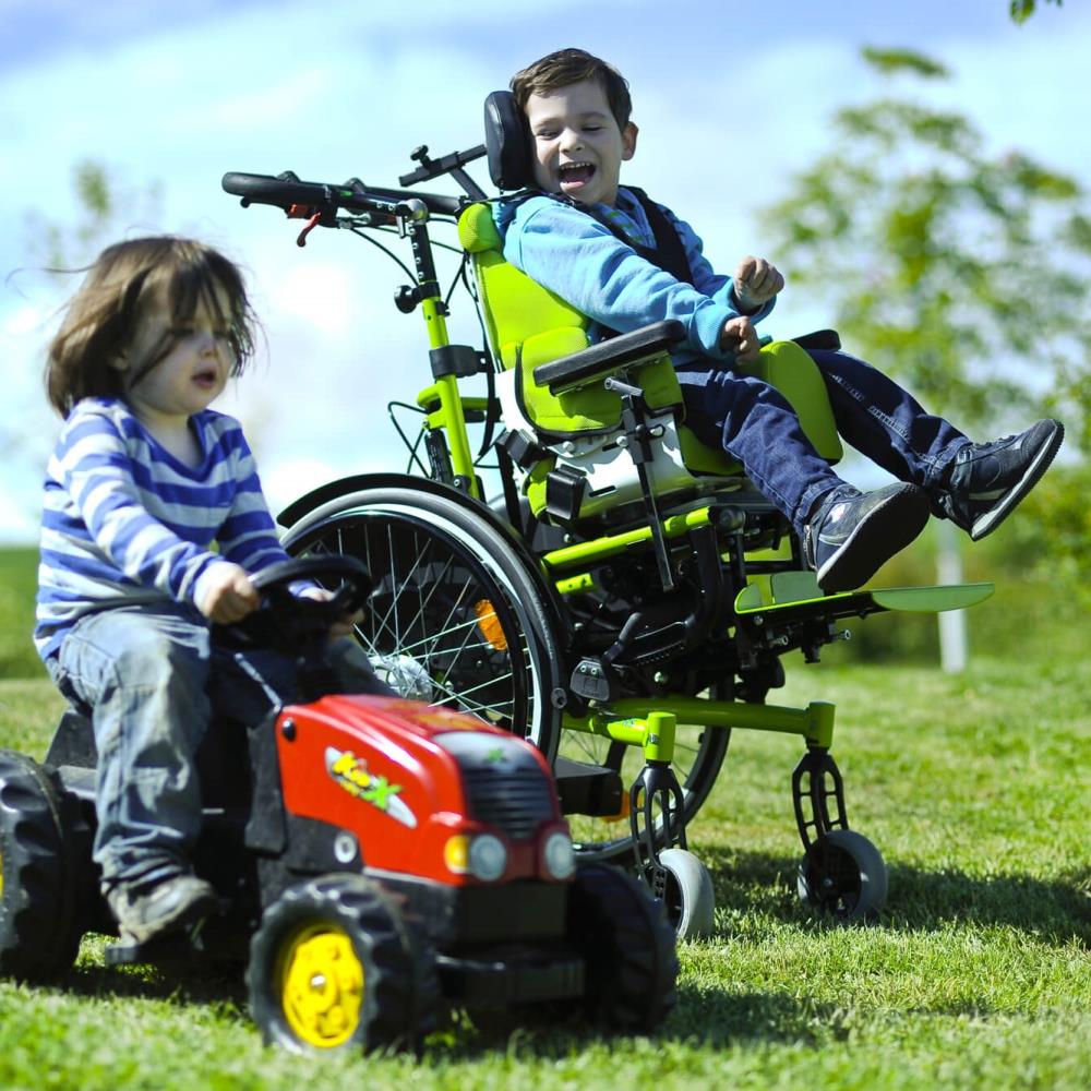 Zippie RS Tilt In Space Wheelchair - Boy laughing on wheelchair.